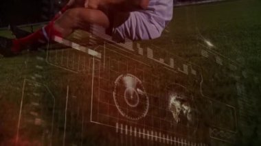 Animation of data processing over caucasian male soccer player lying. Global sport and digital interface concept digitally generated video.