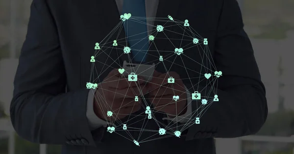 Image of network of connections with icons over men using smartphone. global connections, business, digital interface, technology and networking concept digitally generated image.