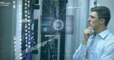 Animation of scope scanning and data processing over caucasian male it technician by computer server. global computing and data processing concept digitally generated video.