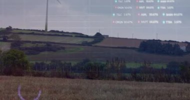 Rüzgar türbini üzerinde finansal veri işleme animasyonu. küresel çevre, sürdürülebilirlik, veri işleme ve dijital olarak üretilen iş konsepti.