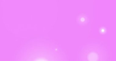 Digital animation of spots of light against copy space on pink background. technology backgrounds concept