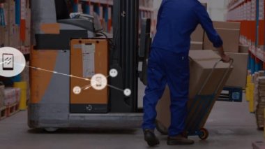 Animation of network of connections with icons over caucasian male warehouse worker. business, connections, technology and delivery services concept digitally generated video.