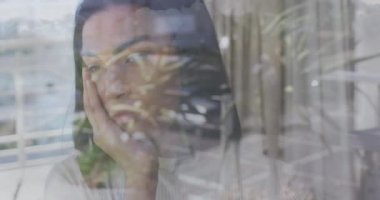 Animation of sad african american woman over balcony. Health, fitness and digital interface concept digitally generated video.