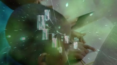 Glowing green particles floating against group of diverse students studying in the class at school. school and education concept