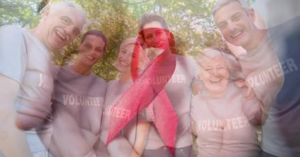 Animation Diverse Group Volunteers Cancer Ribbon International Day Charity Celebration — Stock Video