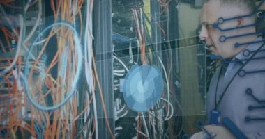Animation of data processing over caucasian man checking servers. computers, network, data processing, communication and technology concept digitally generated video.