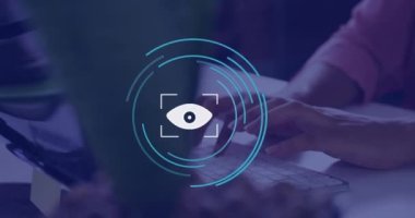 Animation of eye icon over hands using computer in office. Global business and digital interface concept digitally generated video.