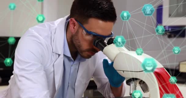 Two Globes Spinning Male Caucasian Scientist Using Binoculars Laboratory Medical — 비디오