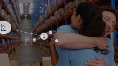 Animation of network of connections with icons over happy diverse warehouse workers. business, connections, technology and delivery services concept digitally generated video.