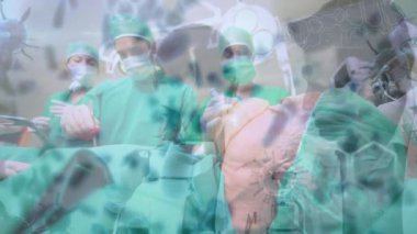Animation of covid 19 cells over diverse surgeons wearing face masks in operating theatre. global covid 19 pandemic, medicine and healthcare services concept digitally generated video.