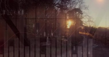 Finansal grafiklerin ağaçlarla çevrelenmiş hali. tarım, finans ve ekonomi konsepti dijital olarak üretilen video.