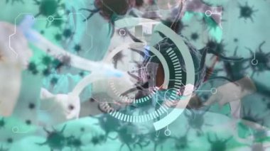 Animation of scope and covid 19 cells over diverse surgeons wearing face masks in operating theatre. global covid 19 pandemic, medicine and healthcare services concept digitally generated video.