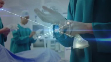 Glowing network of connections against mid section of surgeon wearing surgical gloves at hospital. medical research and science technology concept
