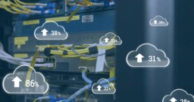 Animation of cloud icons with growing numbers over server room. global technology, data processing and digital interface concept digitally generated video.
