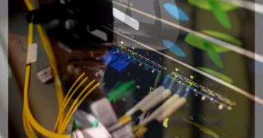 Animation of server room over biracial man using vr headset. global technology and digital interface concept digitally generated video.