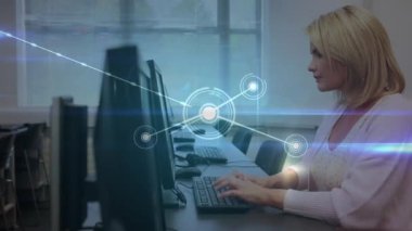 Animation of network of connections over caucasian female teacher using computer. global education, connections and digital interface concept digitally generated video.