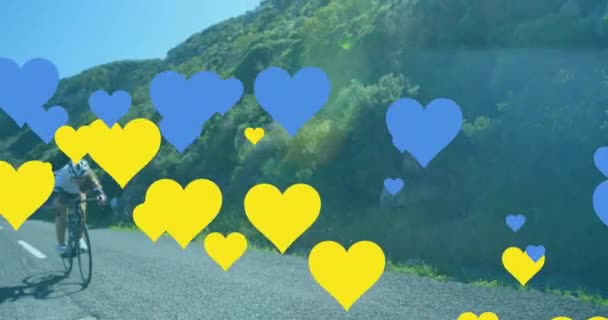 Animation Blue Yellow Hearts Caucasian Woman Cycling Global Sport Digital — Stockvideo