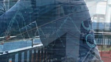 Animation of globe and graphs over happy caucasian man using smartphone. business, finance, economy and technology concept digitally generated video.