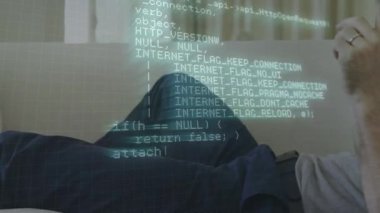 Animation of data processing over caucasian businessman using smartphone. Global business and digital interface concept digitally generated video.