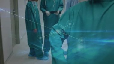 Network of connections against portrait of african american male surgeon in hospital corridor. healthcare and medical technology concept