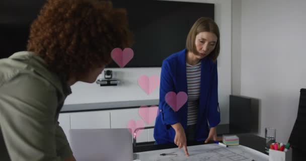 Animation Hearts Falling Diverse Women Using Laptop Global Business Finances — Αρχείο Βίντεο