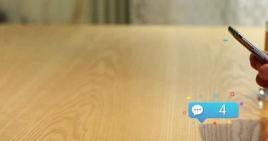 Animation of social media icons falling over person using smartphone. Social media and communication concept digitally generated video.