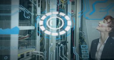 Animation of processing circle and data over caucasian woman checking servers. Network, data processing and technology concept digitally generated video.