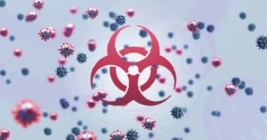 Animation of virus cells over biohazard symbol. global medicine during covid 19 pandemic concept digitally generated video.
