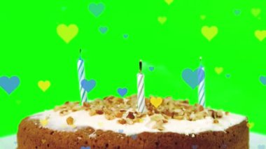 Animation of hearts falling over birthday cake. animation of leaves appearing over sprinkles falling on white surface.