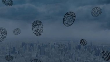 Animation of easter eggs falling over cityscape. spring, easter and city life concept digitally generated video.
