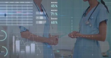 Animation of financial data processing over two diverse female doctors. Global medicine, technology, data processing and digital interface concept digitally generated video.