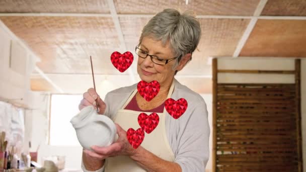 Animation Heart Icons Caucasian Female Worker Painting Pottery Global Business — Vídeos de Stock
