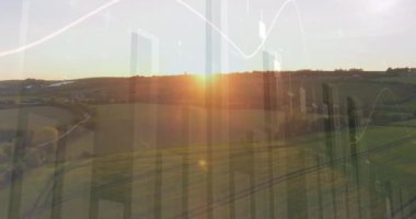 Tarımsal alan ve manzara üzerindeki finansal grafiklerin animasyonu. tarım, finans ve ekonomi konsepti dijital olarak üretilen video.