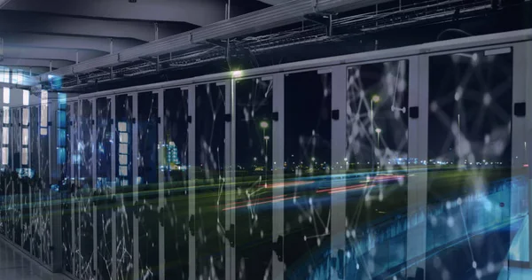 Image of network of connections and server room over road and vehicles in city at night. Global digital network technology concept digitally generated image.