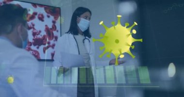 Animation of graph and virus cells over diverse doctors wearing face masks. Global medicine, healthcare and digital interface concept digitally generated video.