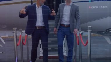 Animation of data processing over caucasian businessmen talking. global business, finances, connections and digital interface concept digitally generated video.