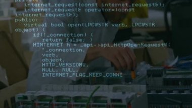Animation of data processing over caucasian man with computer circuit board. Global technology and digital interface concept digitally generated video.