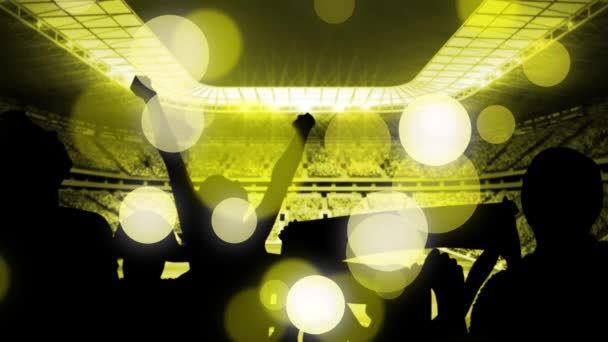 Animation of yellow dots over peoples silhouette and sport stadium. Sport, competition and celebration concept digitally generated video.