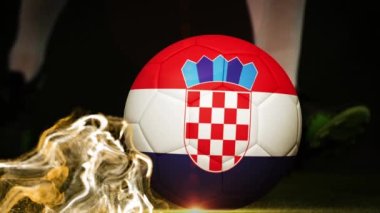 Animation of glitter over legs of caucasian male soccer player kicking ball with flag of croatia. Sport, competition and celebration concept digitally generated video.