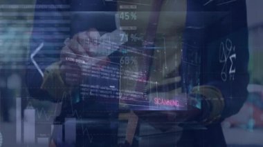 Digital interface with data processing over mid section of man cleaning smartphone with disinfectant. Computer interface and business technology concept