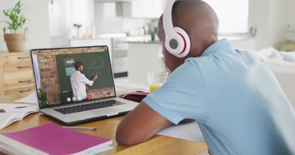 African American Teenage Boy Using Laptop Video Call Male Teacher — 图库视频影像