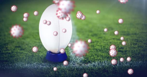 体育场橄榄球球上病毒细胞的动画化 竞赛和视频视频19大流行病概念数字生成视频 — 图库视频影像