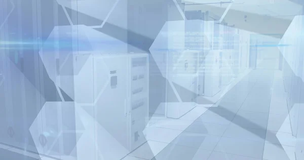 Image of hexagons over tech room with computer servers. digital interface global connection and communication concept digitally generated image.