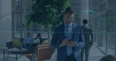 Animation of financial data over globe and caucaian businessman using smartphone. Global economy, finance, business and technology concept digitally generated video.