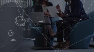 Animation of network of connections over diverse female and male businesspeople with laptop. Business, network, connections and technology concept digitally generated video.