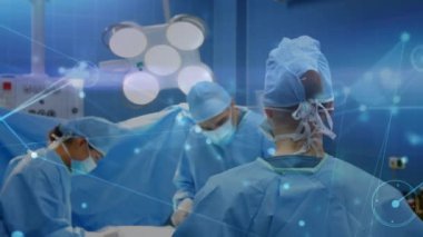 Animation of data processing over diverse surgeons during surgery. global medicine, connections and digital interface concept digitally generated video.