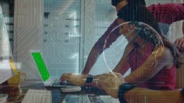 Animation of computer circuit board and data processing over diverse business people in office. global business, computing and digital interface concept digitally generated video.