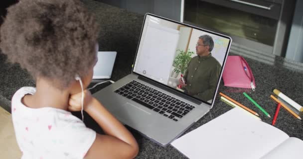 African American Girl Using Laptop Video Call Male Teacher Screen — Stockvideo