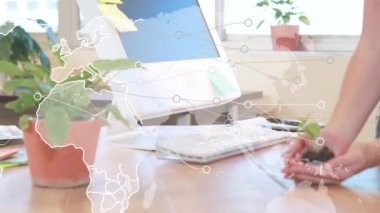 Kafkasyalı bir kadının elinde bitki tutarken dünya haritası ve bağlantıların canlandırılması. Bağlantılar, küresel ağ, doğa ve ekoloji kavramı dijital olarak oluşturulmuş video.