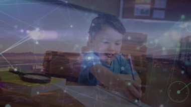 Animation of network of connections over asian boy at school. School, education and learning with technology concept digitally generated video.